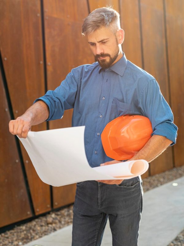front-view-man-with-blueprint_23-2148269815 front-view-man-with-blueprint_23-2148269815